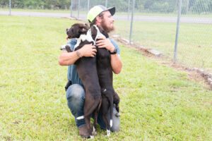 Soperton Animal Control Shelter in Georgia dogs playing with staff